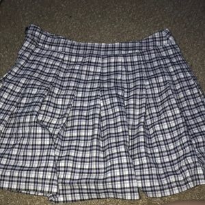 Medium sized purple black and white plade skirt